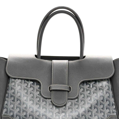 Grey Goyard tote front with leather handle, buckled strap detail and patterned canvas