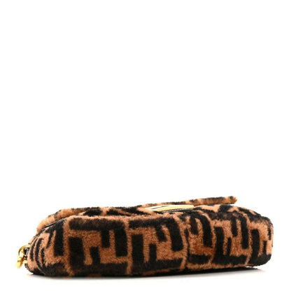 Shearling Baguette bag with FF pattern, low-profile shape, tobacco and black.