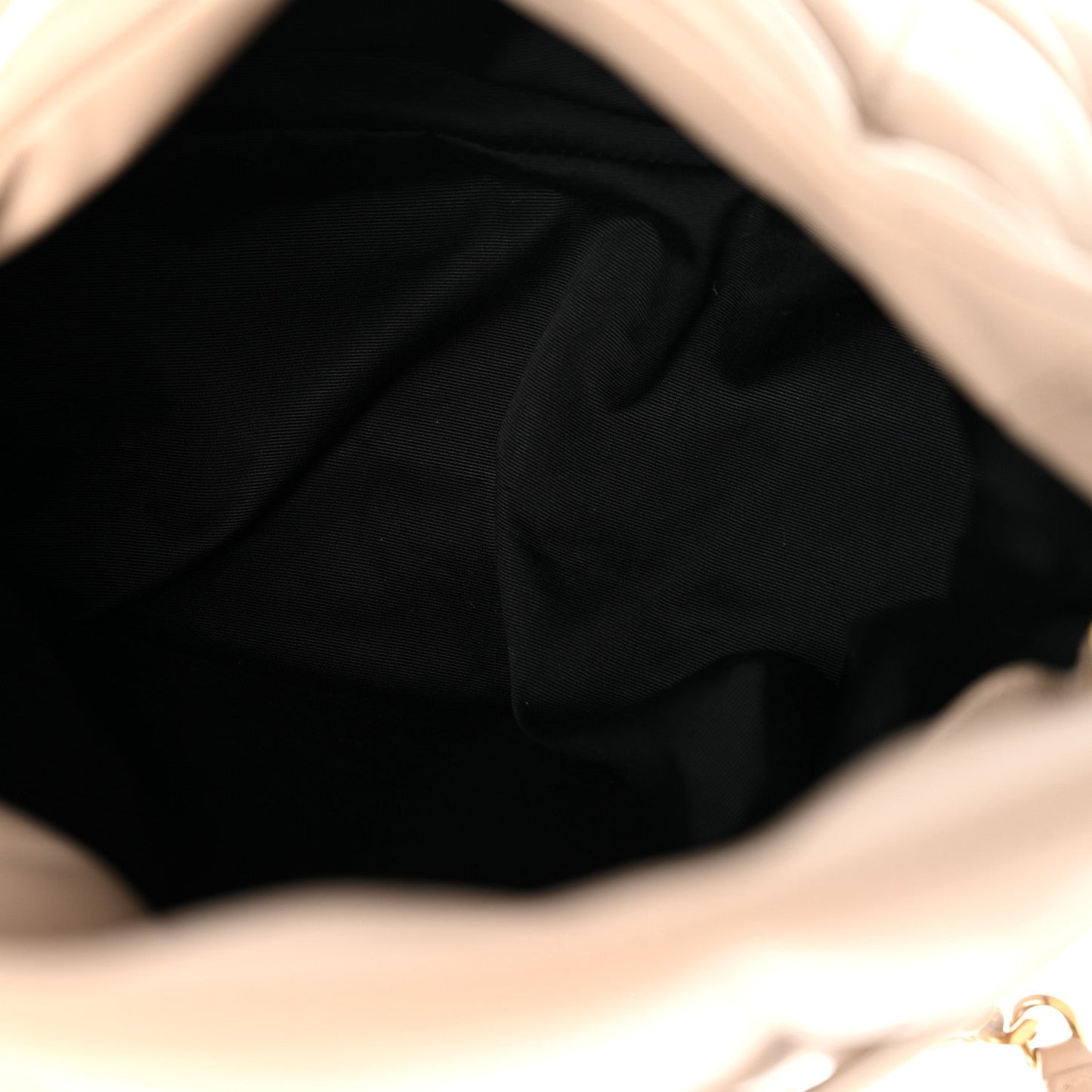 Satchel interior lining in black fabric with visible opening edge