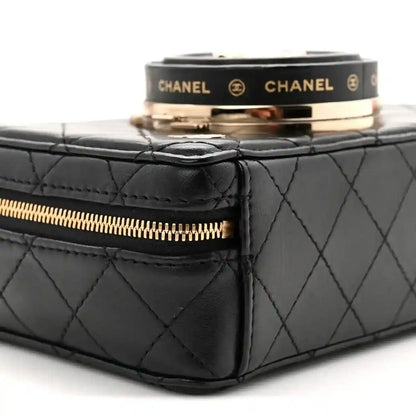 Black quilted lambskin bag with gold-tone zipper and side panel stitching