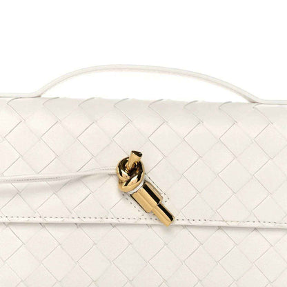 White intrecciato nappa clutch front flap with gold-tone bar clasp detail