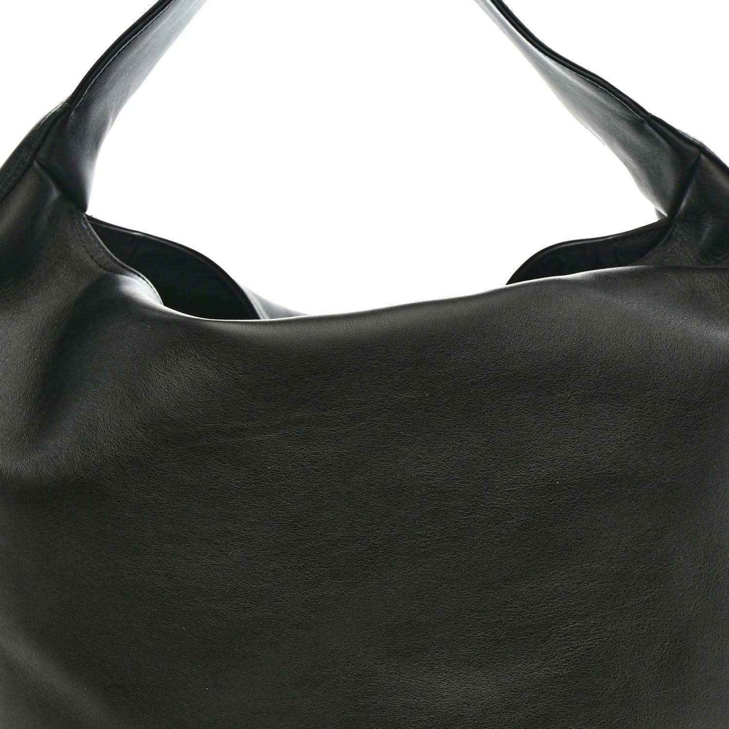 Black leather hobo bag opening with structured top edge and smooth calfskin texture