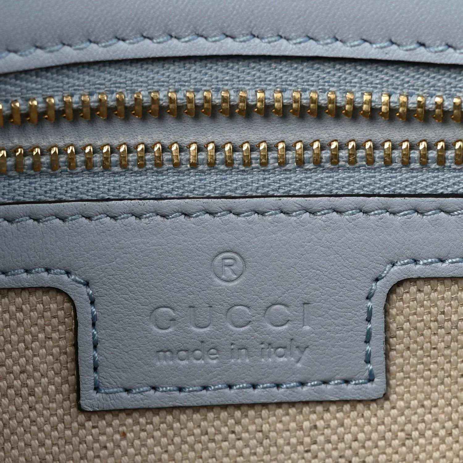 Light blue calfskin bag with gold zipper and stitched trim