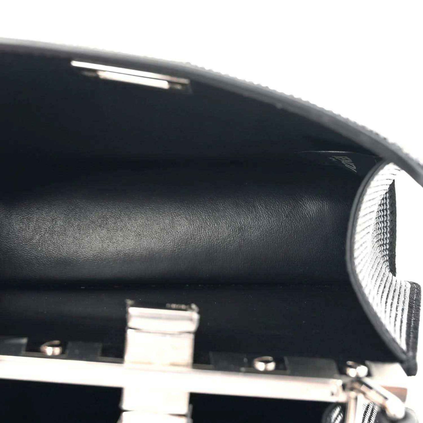 Fendi black leather satchel interior with snap hardware and panel edge