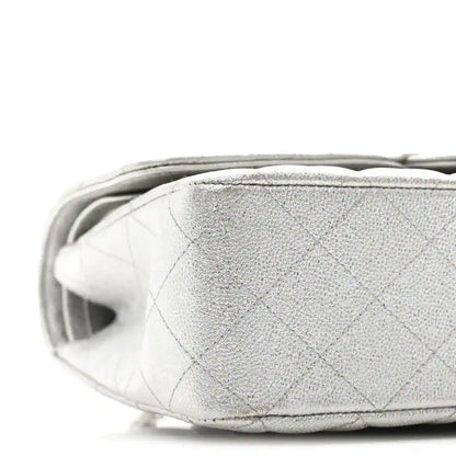 Chanel silver metallic double flap bag side panel close-up with quilted texture