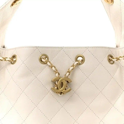 Small quilted caviar leather handbag in white with gold chain and CC logo charm