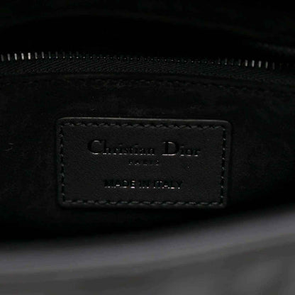 Interior label on a black Lady Dior handbag with zipper track visible