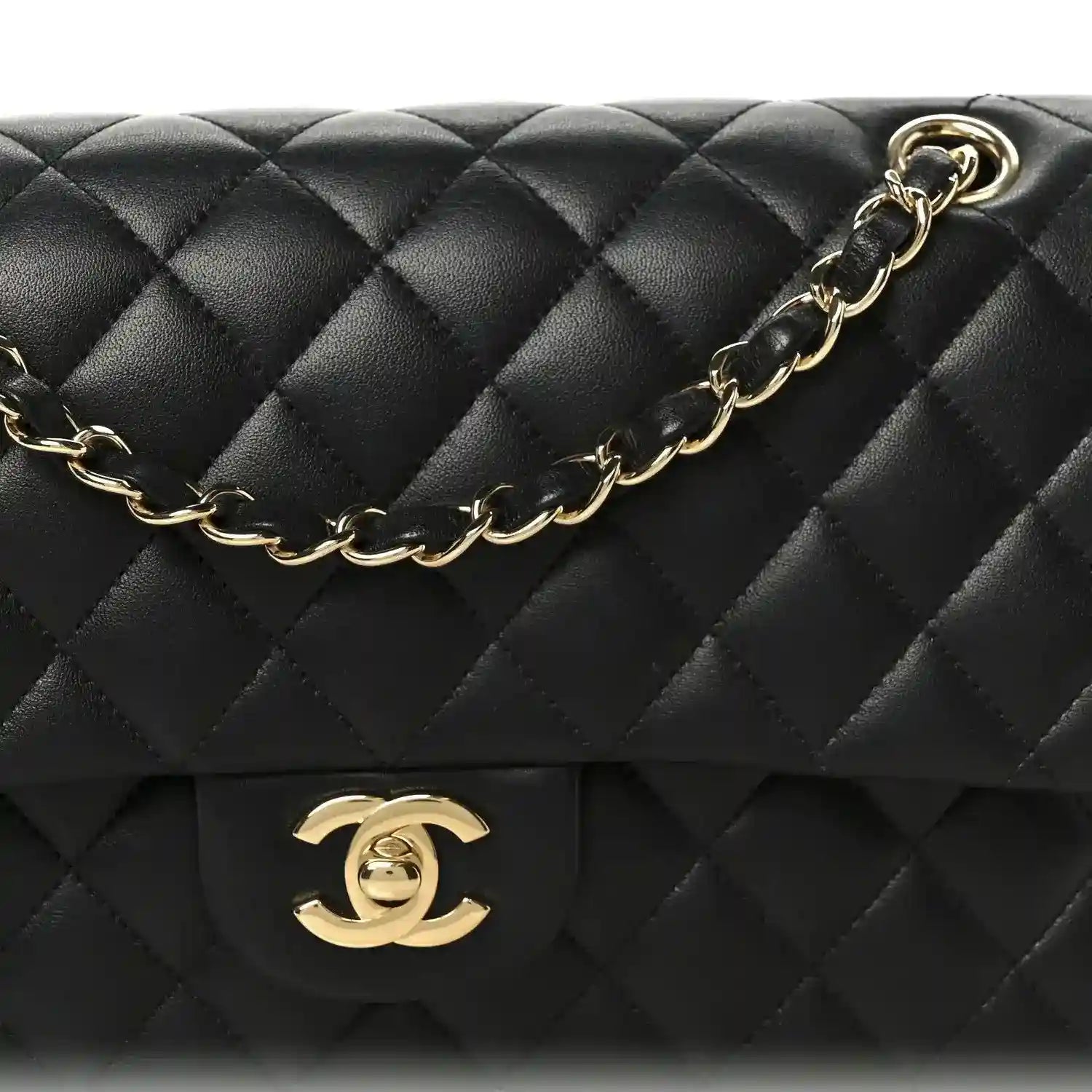 Chanel black quilted flap with gold logo and attached gold chain strap