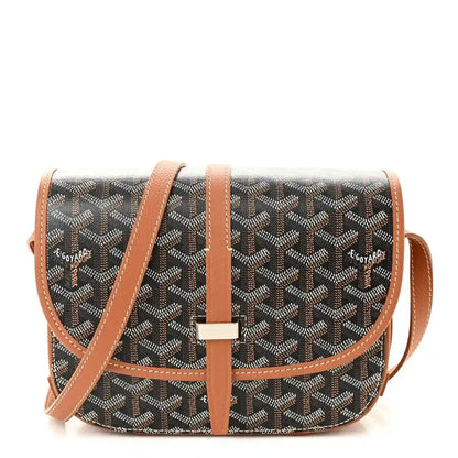 Monogram messenger bag with dark pattern, tan leather trim, front flap and crossbody strap