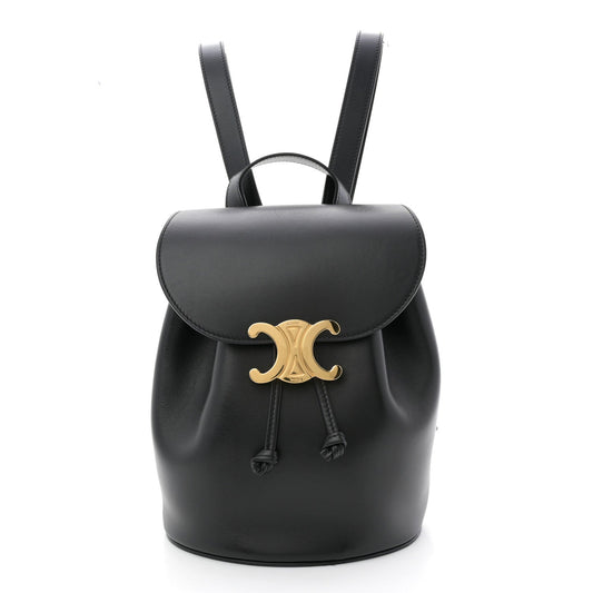 Celine Triomphe calfskin Bonnie backpack in black with gold logo and drawstring.