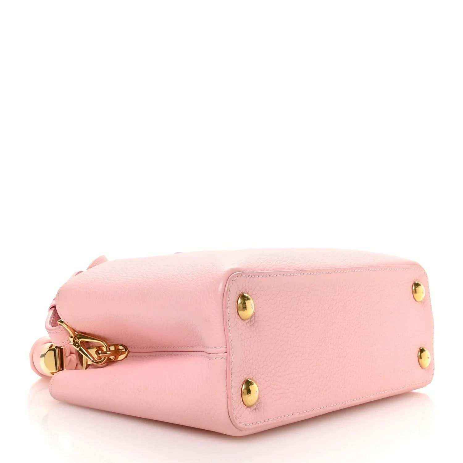 Bubble gum pink leather Capucines BB bag with flap top and gold turn-lock closure