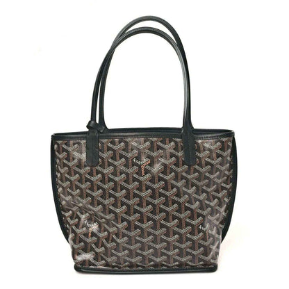 Goyard monogram mini tote bag with top handles and black trim, front view.