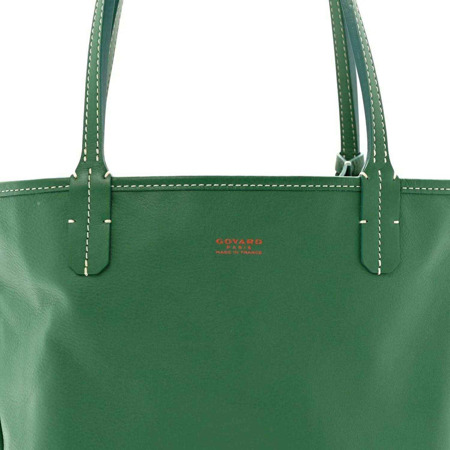Green mini tote bag front with stitched handles and small red logo