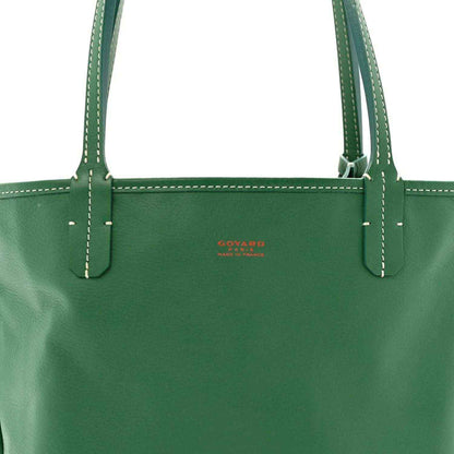 Green mini tote bag front with stitched handles and small red logo