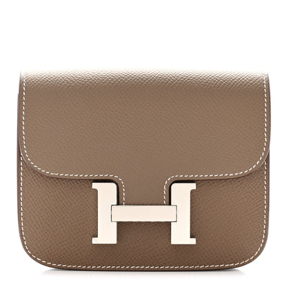 Taupe slim wallet with front H clasp and white contrast stitching