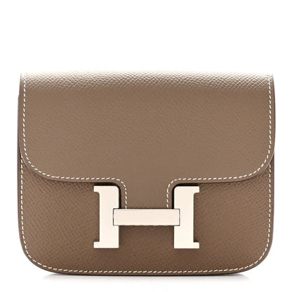 Taupe slim wallet with front H clasp and white contrast stitching