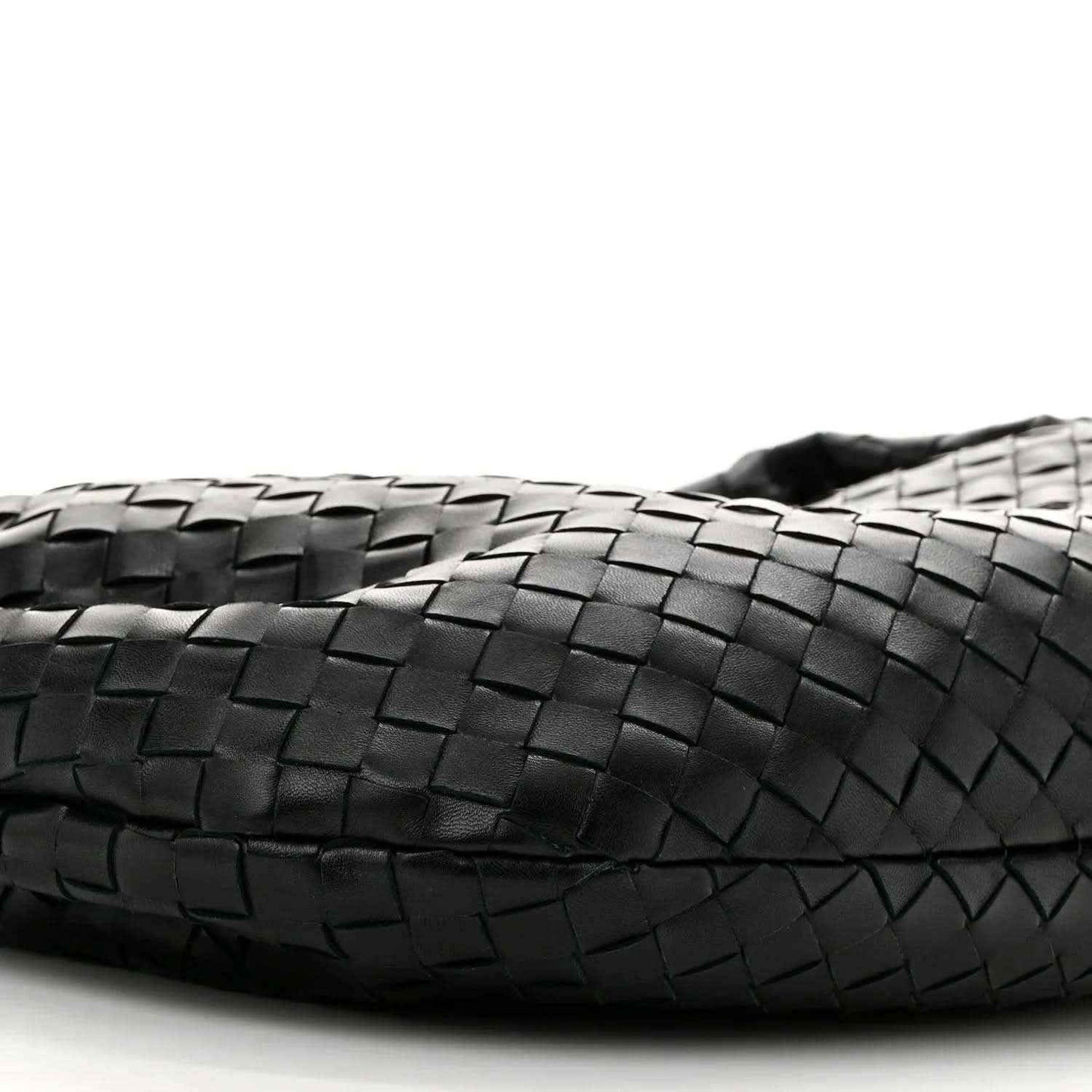 Black leather bag front with intrecciato weave detail and stitched edge