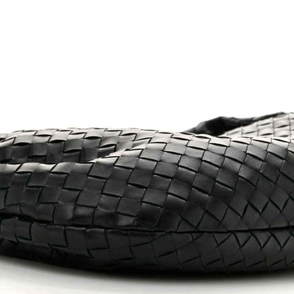 Black leather bag front with intrecciato weave detail and stitched edge