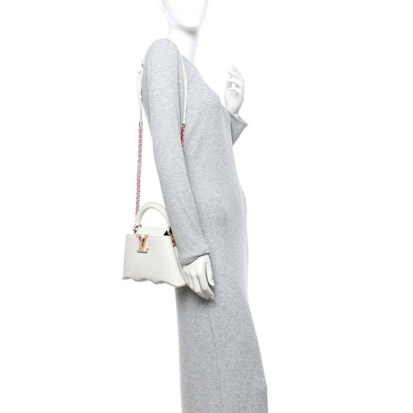 Louis Vuitton Capucines mini handbag, white, side view with shoulder strap