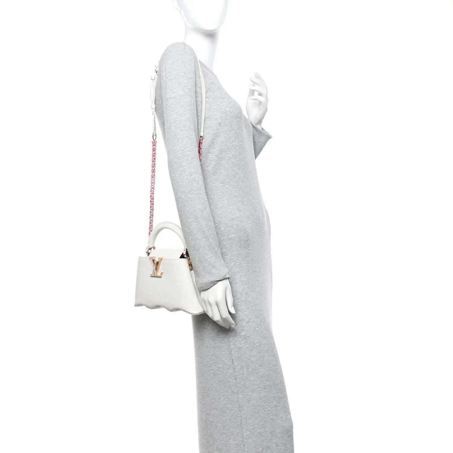 Louis Vuitton Capucines mini handbag, white, side view with shoulder strap