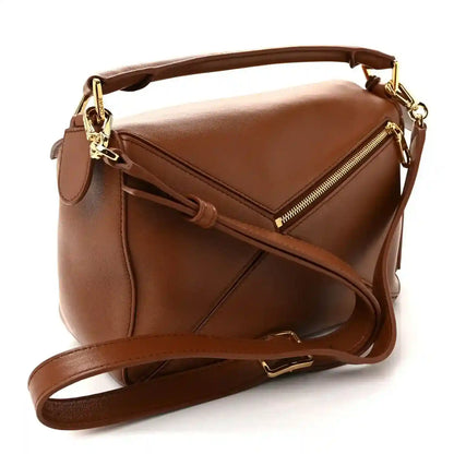 Small pecan brown leather shoulder bag with side zip, top handle, gold hardware