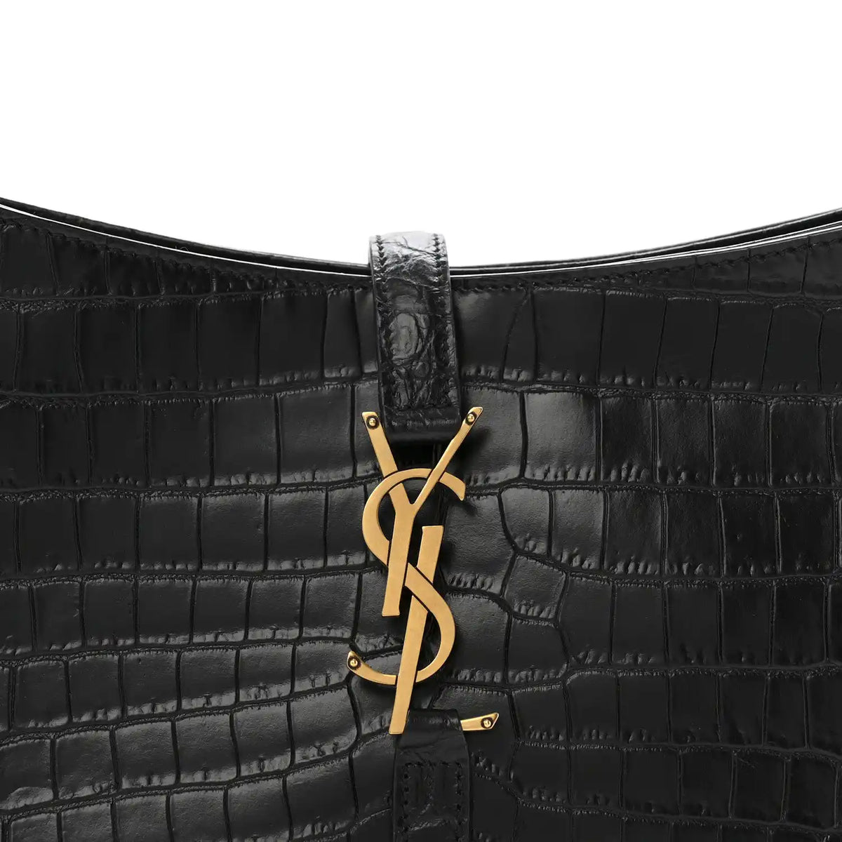 Close-up of black crocodile-embossed bag front with YSL clasp hardware.