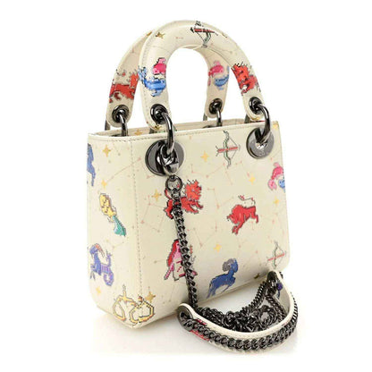 Mini Lady Dior bag with chain strap, white pixel zodiac print, round top handles