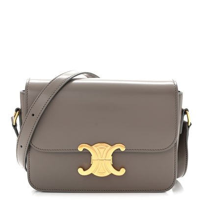 Celine shiny calfskin shoulder bag with gold-tone logo and flap closure, light gray