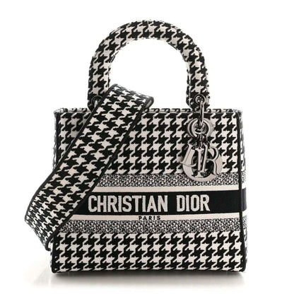 Christian Dior canvas bag in black-and-white houndstooth with top handles and logo strap
