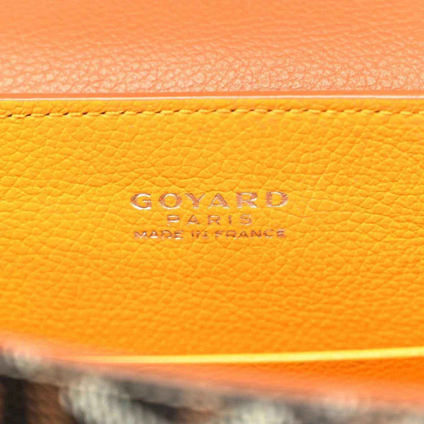 GOYARD stamped on orange leather lining of mini Saigon bag