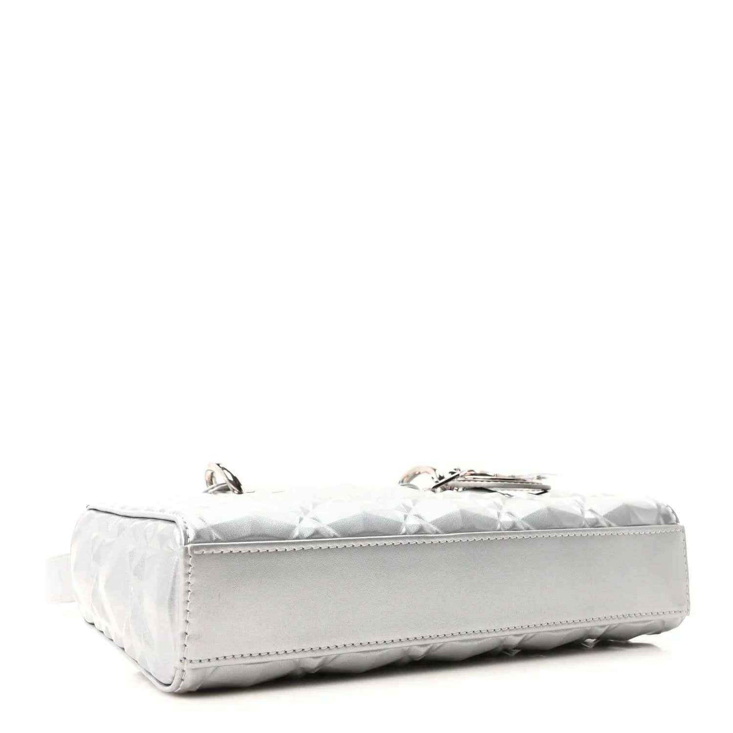 Small metallic silver handbag with geometric texture and stitched base corners, flap side view.
