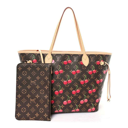 Monogram tote bag with cherry print, front pocket panel and tan leather handles.