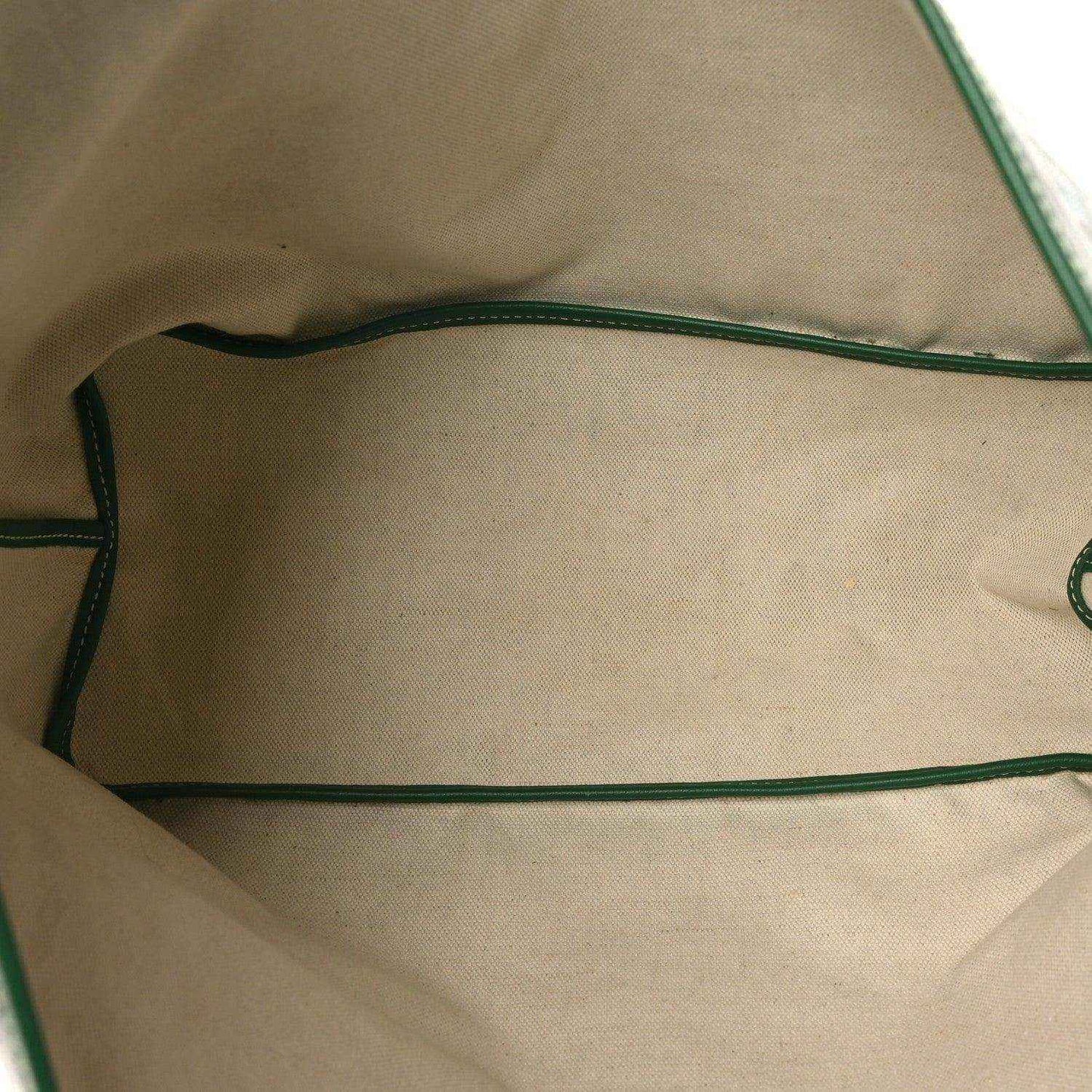 Tote bag interior view with beige lining and green trim along seams