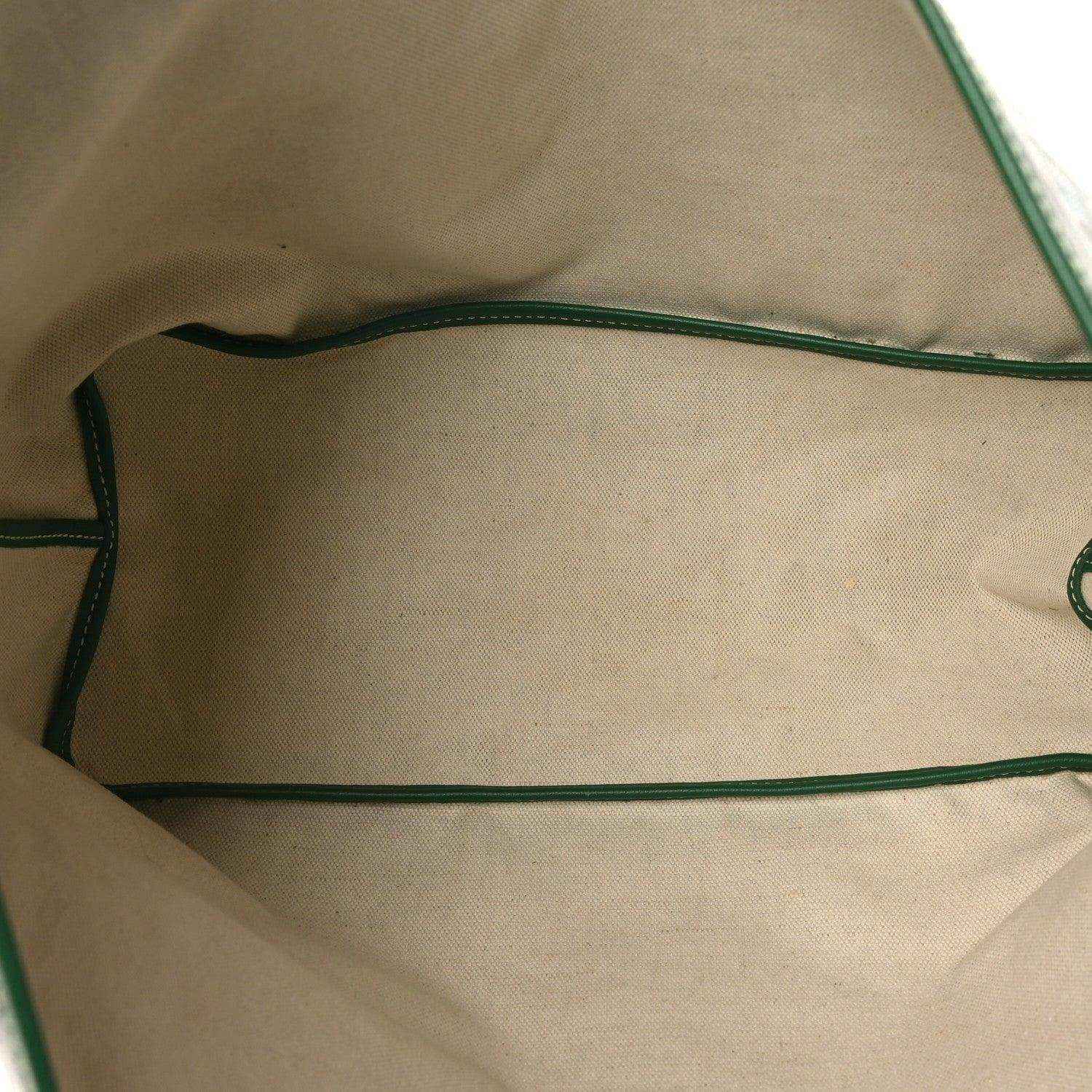 Tote bag interior view with beige lining and green trim along seams