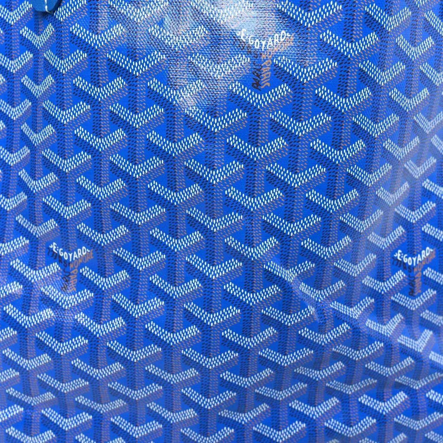 Blue Goyardine fabric with repeating Goyard pattern and small Goyard text.