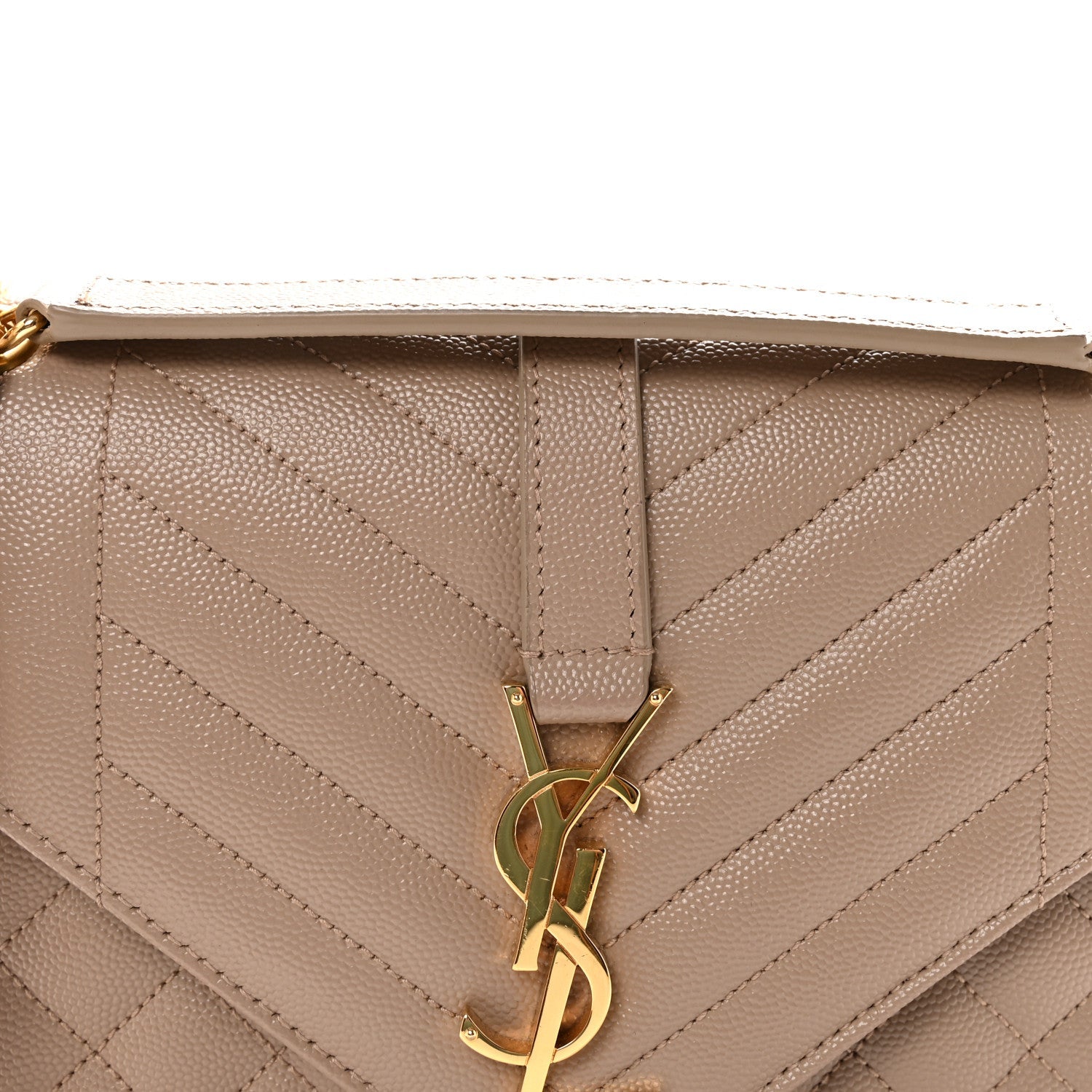 Dark beige satchel front close-up with quilted diamond pattern and gold-tone YSL monogram clasp.