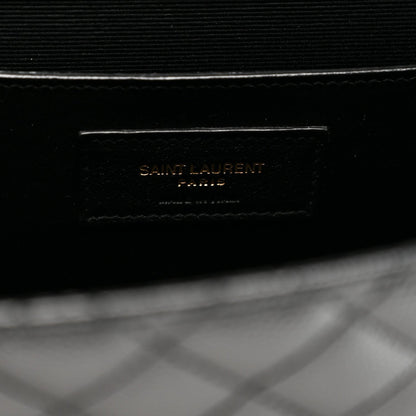 Black satchel inner label area with Saint Laurent text on flap
