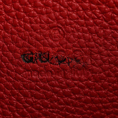 Red pebbled leather with embossed script logo