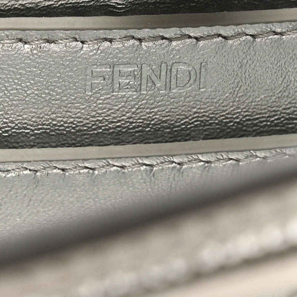Embossed FENDI lettering on interior leather lining, with stitching detail.