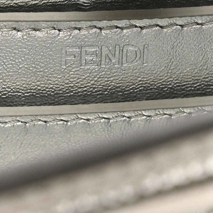 Embossed FENDI lettering on interior leather lining, with stitching detail.