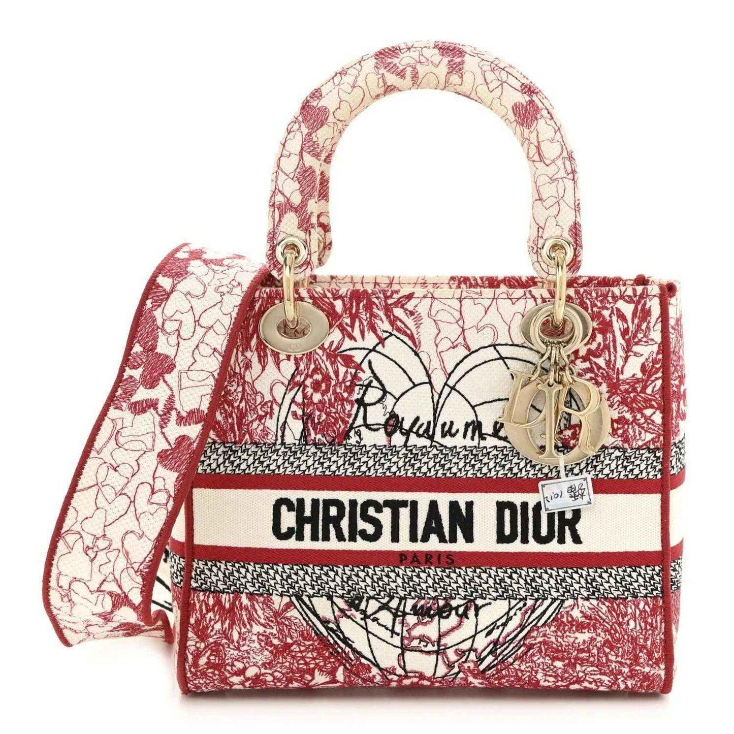 Medium embroidered canvas tote with red-and-white heart pattern, top handles, logo stripe.