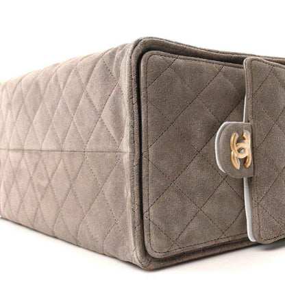 Chanel quilted suede shoulder bag, dark grey, side buckle with gold CC hardware