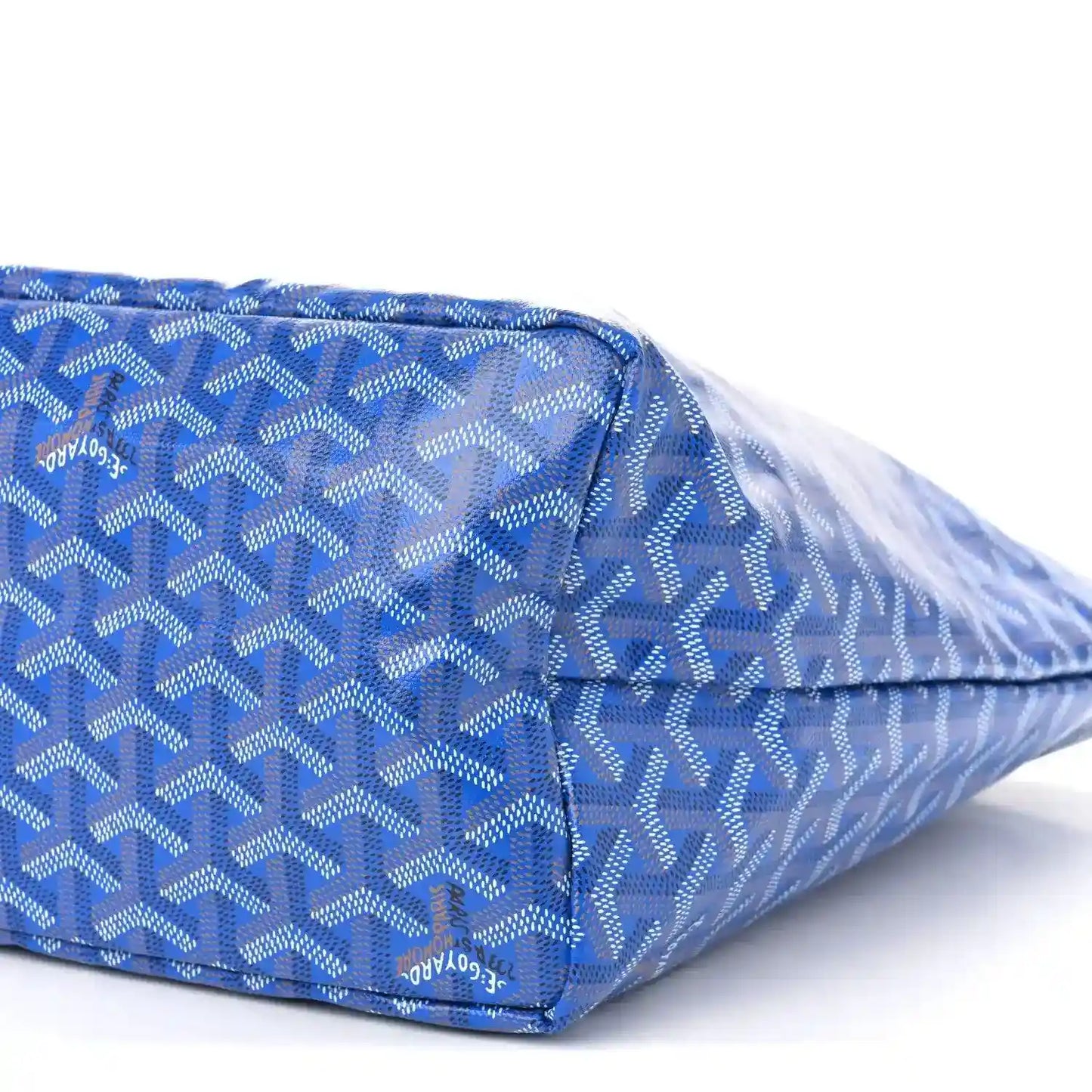 Sky blue patterned tote bag with zip top and leather trim