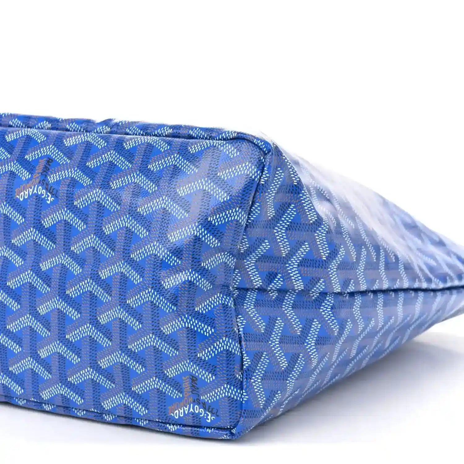 Sky blue patterned tote bag with zip top and leather trim