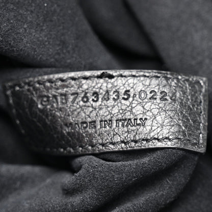 Black leather Bea tote label with size code and “MADE IN ITALY”
