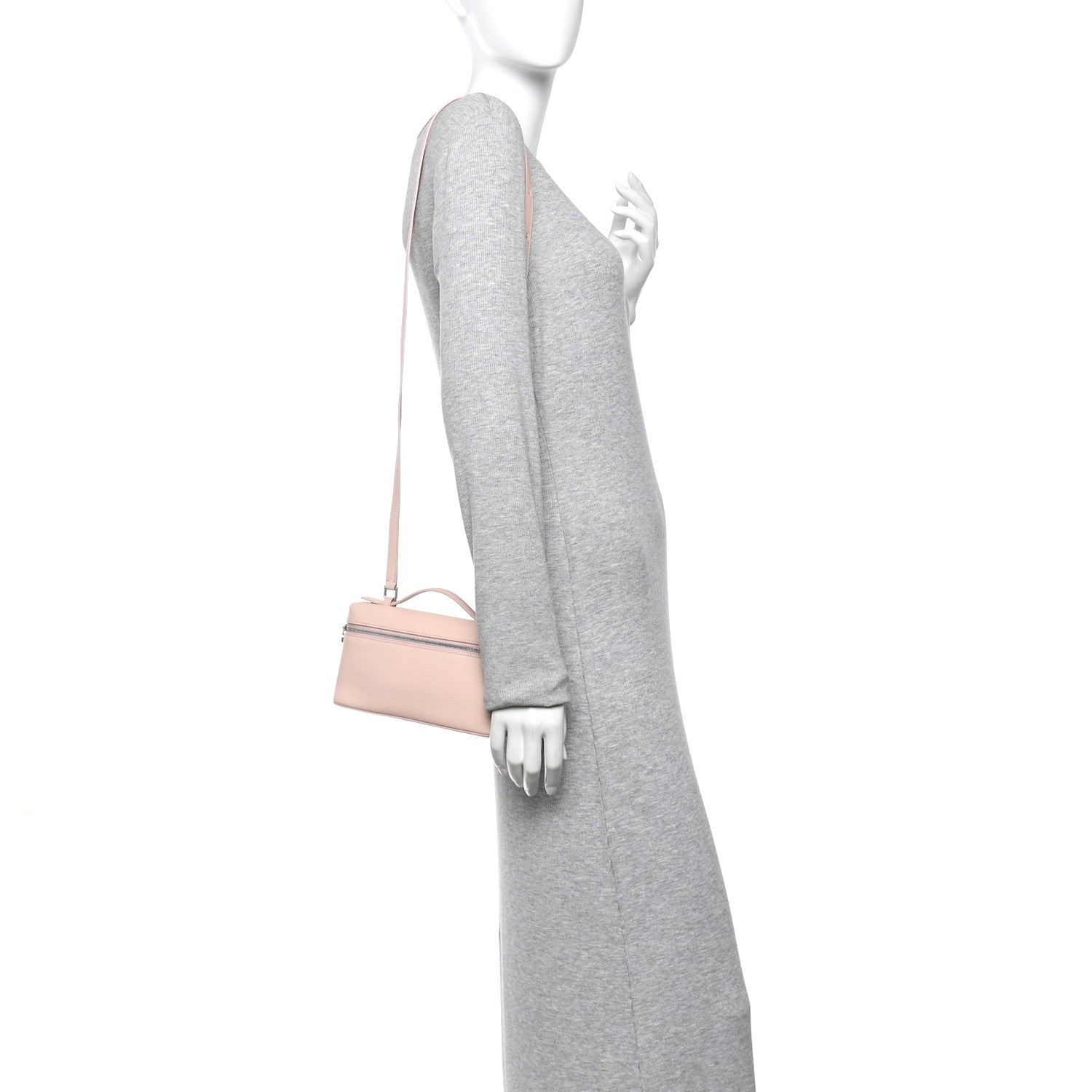 Light pink leather pouch with crossbody strap shown on model