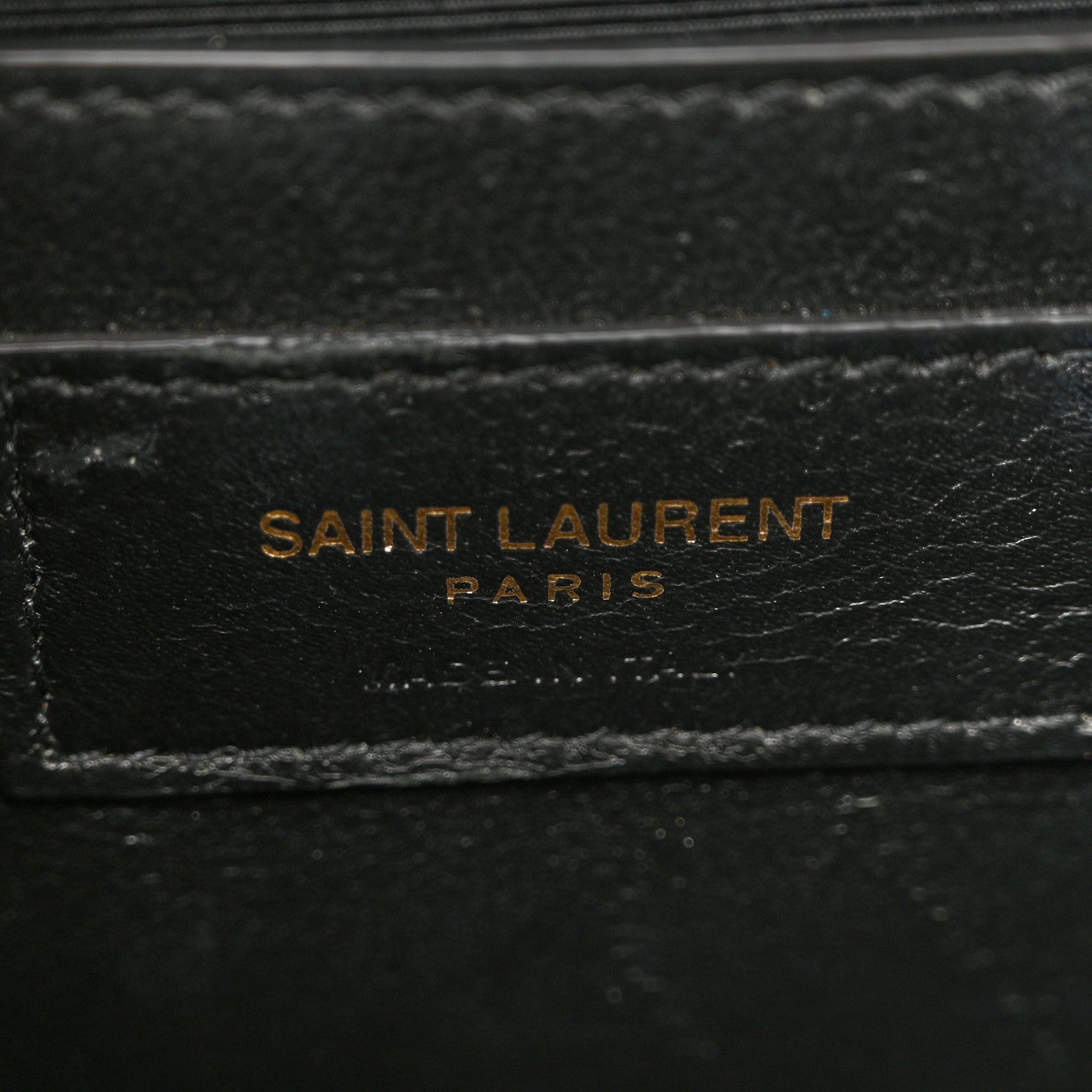 Grain-textured satchel lining with SAINT LAURENT PARIS stamp
