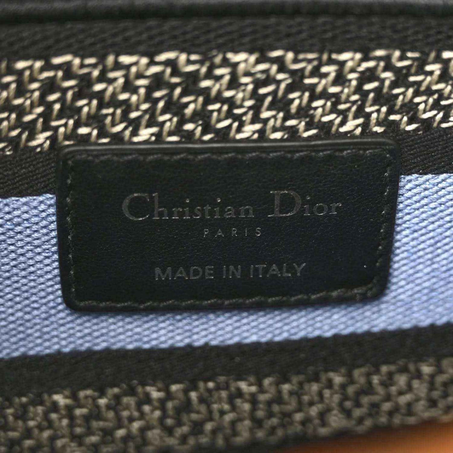 Interior fabric label reading Christian Dior, PARIS, and MADE IN ITALY