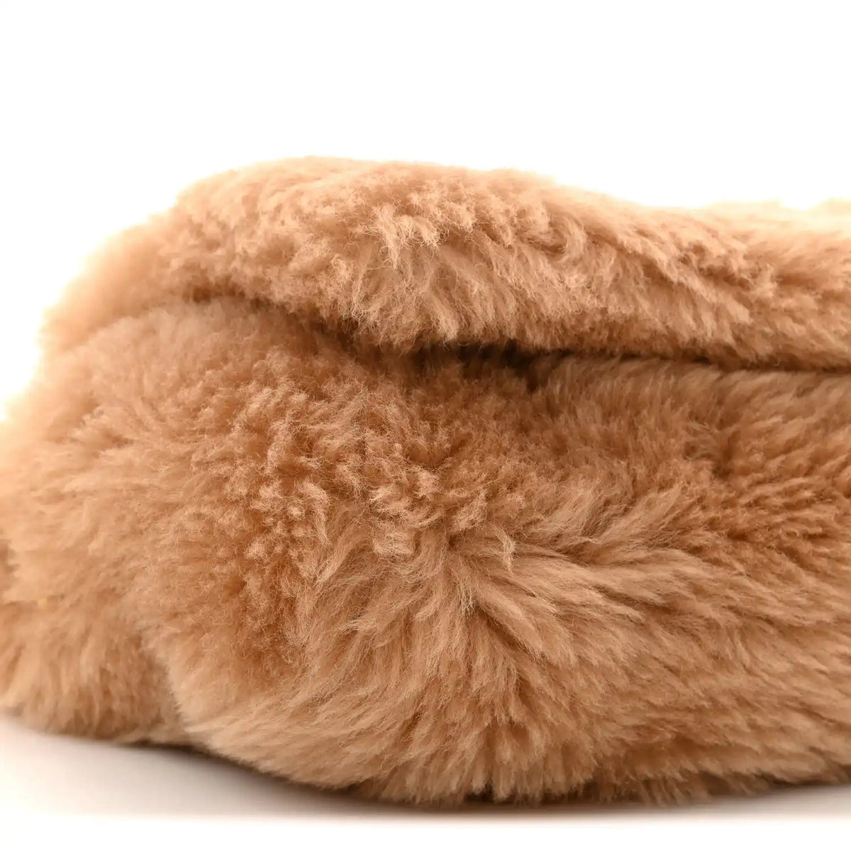 Saint Laurent shearling satchel with light brown plush texture, folded edge detail