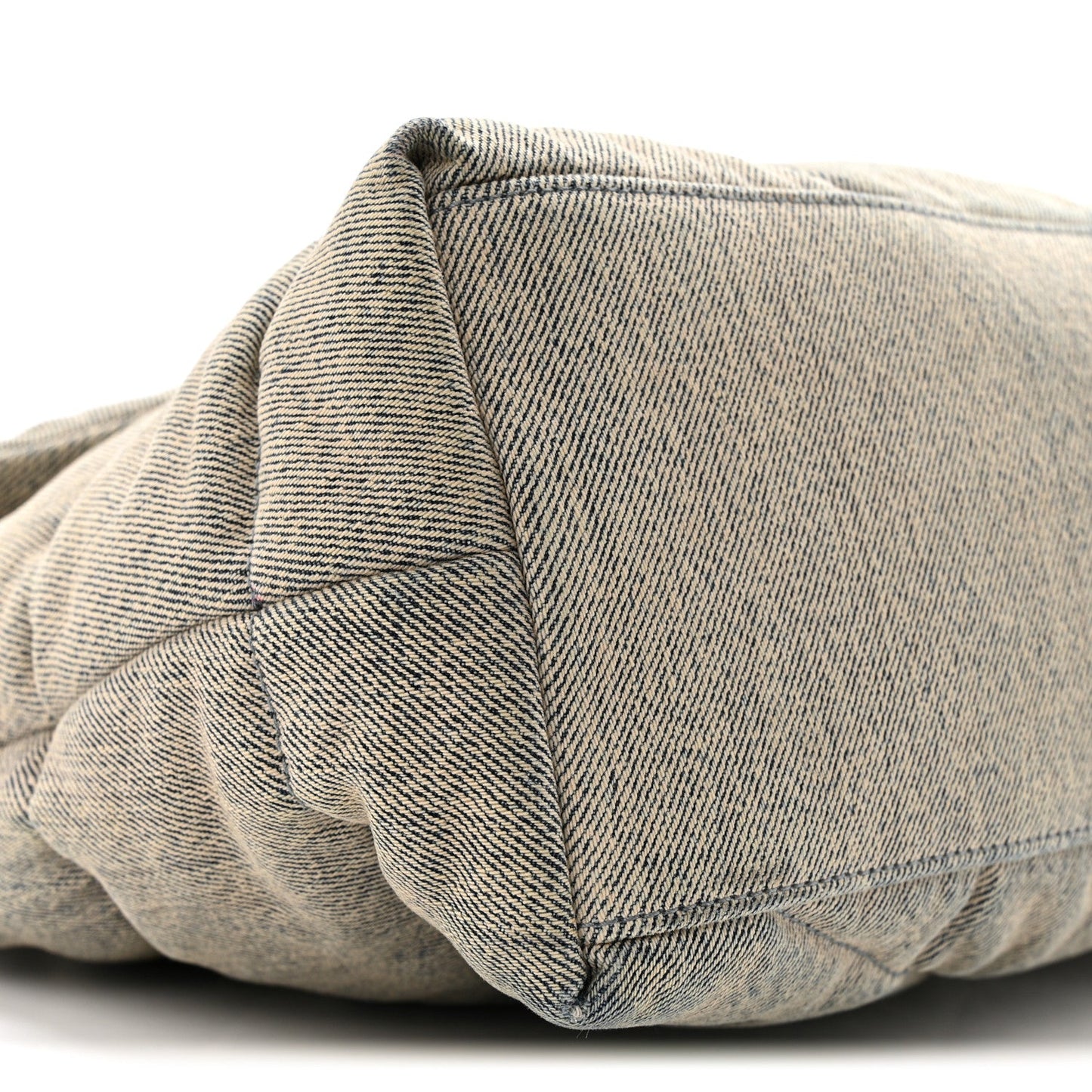 Quilted denim puffer satchel with structured seam detail